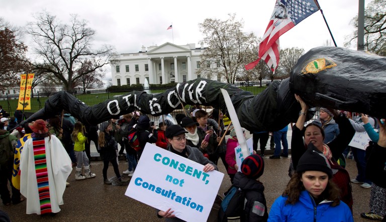 Demonstrators protest outside of the White House to rally against the construction of the disputed Dakota Access oil pipeline. Approving the Dakota Access pipeline has been a priority for President Trump and his administration. (AP Photo/Jose Luis Magana)