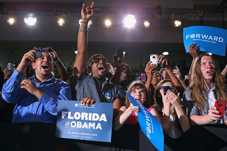KISSIMMEE, FL - SEPTEMBER 08: Supporters cheer for U.S. President Barack Obama at a campaign rally at the Kissimmee Civic Center September 8, 2012 in Kissimmee, Florida. Working with the momentum from this week's Democratic National Convention, Obama is on a two-day campaign swing from one side of Florida to the other on the politically important I-4 corridor. (Photo by Chip Somodevilla/Getty Images)