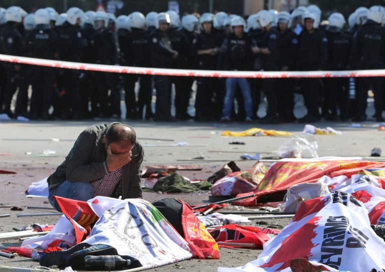 A man cries over the body of a victim, at the site of an explosion in Ankara, Turkey, Saturday, Oct. 10, 2015. (AP Photo/Burhan Ozbilici)