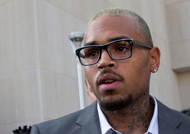 Singer Chris Brown leaves District of Columbia Superior Court in Washington, Tuesday, Sept. 2, 2014, after pleading guilty on a misdemeanor assault. Brown pleaded guilty on Tuesday to hitting a man outside a Washington hotel, an assault that occurred while the singer was on probation for attacking his then-girlfriend Rihanna. Brown pleaded guilty to misdemeanor assault and was sentenced to time served. He spent two days in a District of Columbia jail in this case.   (AP Photo/Manuel Balce Ceneta)