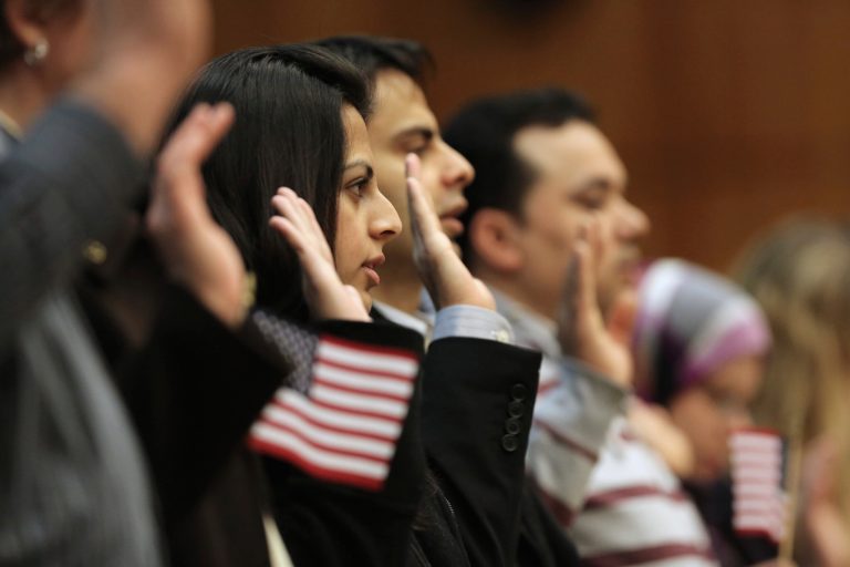 Pakistani immigrants and married couple Mehar Usman and Usman Rasheed prepare to become U.S. citizens at a naturalization ceremony on February 14, 2014, in the Brooklyn borough of New York City. (Photo by John Moore/Getty Images)
