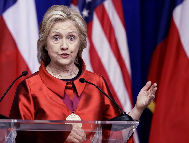 In one instance, all mention of an alleged high-level cover-up of misconduct from Hillary Clinton's security team while on official travel was cut from the published report. (AP Photo)Â 