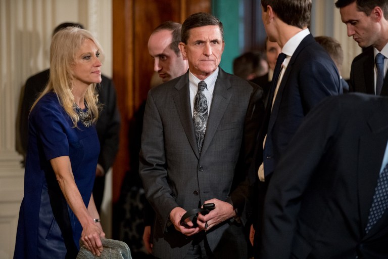 Flynn (center) has come under fire for statements he made about his contact with the Russian ambassador before Trump took office. (AP Photo/Andrew Harnik)