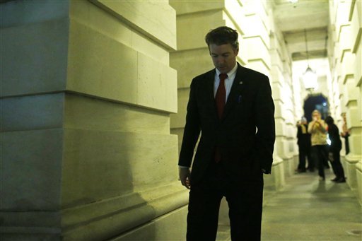 Sen. Rand Paul, R-Ky., walks out of the Capitol after his filibuster of the nomination of John Brennan to be CIA director on Capitol Hill in Washington, early Thursday, March 7, 2013. (AP Photo/Charles Dharapak)