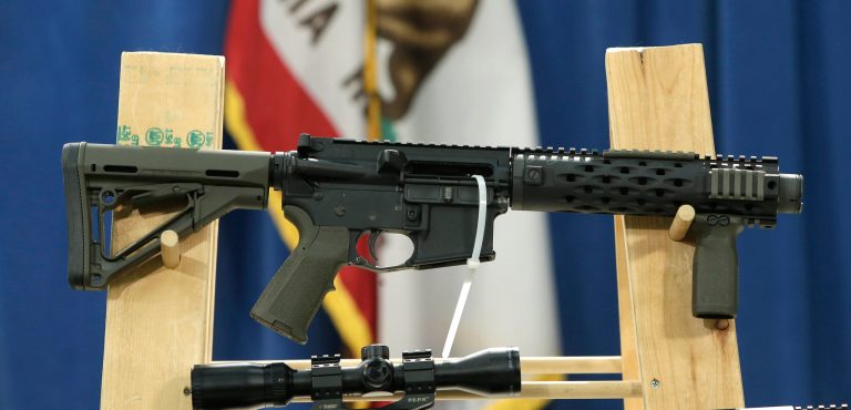A homemade fully automatic rifle, confiscated by the Department of Justice, is displayed at a news conference held by Sen. Kevin de Leon where he unveiled legislation dealing with so-called 