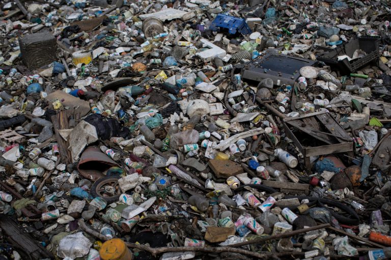 In this May 15, 2014 photo, trash floats on a polluted water channel that flows into the Guanabara Bay in Rio de Janeiro, Brazil. With just over two years to go until the Rio Olympics, nearly 70 percent of the sewage in the metropolitan area of 12 million inhabitants continues to flow untreated, along with thousands of tons of garbage daily, into area rivers, the bay and even Rio's famed beaches like Copacabana and Ipanema.Several Olympic sports federations raised fears that Rio's polluted waters could prove harmful to athletes' health. Exposure to fecal matter can cause Hepatitis A, dysentery, cholera other diseases. (AP Photo/Felipe Dana)
