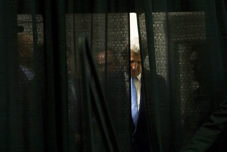 U.S. Secretary of State John Kerry waits offstage while being introduced prior to speaking to members of the U.S. military, U.S. Embassy personnel, and their families at Collier Field House at Yongsan Garrison in Seoul, Monday, May 18, 2015. (Saul Loeb/Pool Photo via AP)