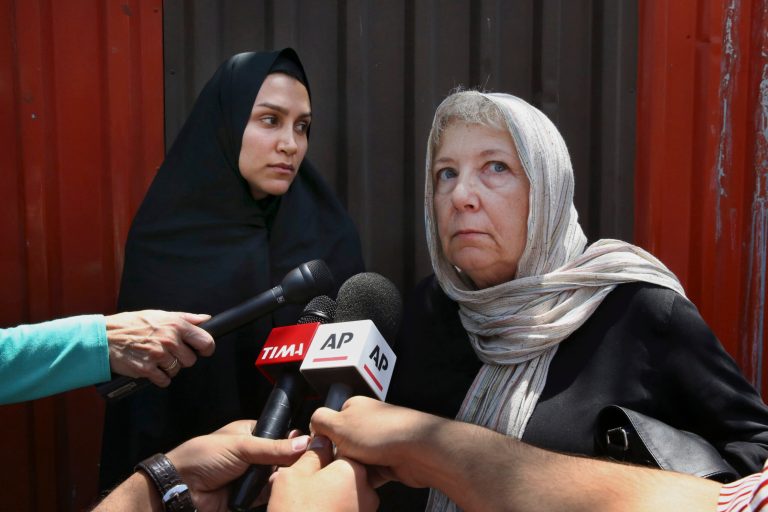 Mary Rezaian, right, mother of detained Washington Post correspondent Jason Rezaian, speaks with the media as Jason's wife Yeganeh Salehi listens after a hearing in Jason's trial at the Revolutionary Court in Tehran, Iran, Monday, July 13, 2015. The third session of the closed-door trial of journalist Rezaian, who has been detained in an Iranian prison for nearly a year, was held Monday, Iran's official IRNA news agency reported. (AP Photo/Vahid Salemi)