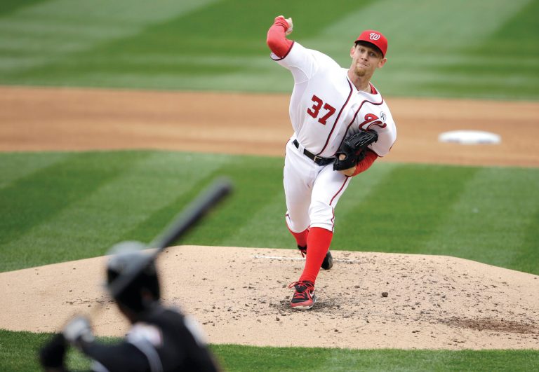 Alex Brandon/AP
Stephen Strasburg allowed three hits and no runs in seven innings as the Nationals opened the season with a shutout of the Marlins.