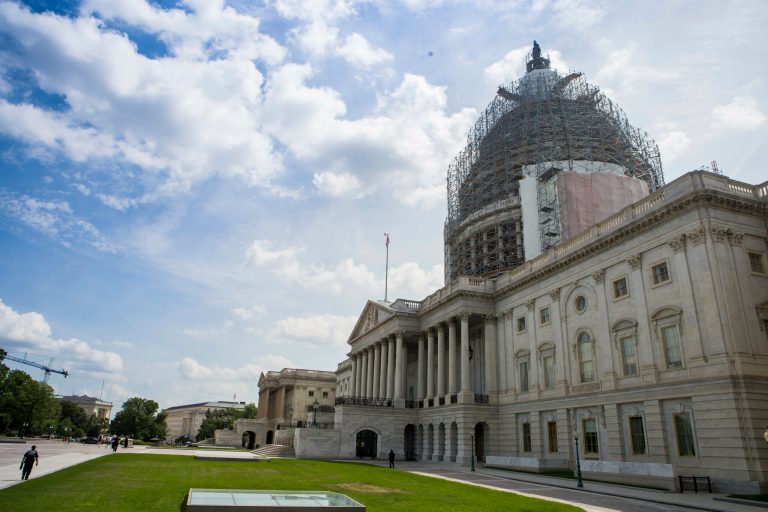 A red Nissan Altima attempted to crash the barricade outside the U.S. Capitol building by driving full speed into the barrier Friday morning. (Graeme Jennings/Washington Examiner)