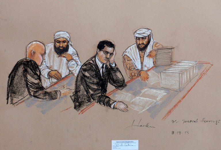 Accused Sept. 11 co-conspirators Ammar al Baluchi, center left, and Ramzi Binalshibh, right, confer with their lawyers during pretrial hearings at the Guantanamo Bay U.S. Naval Base in Cuba, on Aug. 19. (AP Photo/Janet Hamlin, Pool)