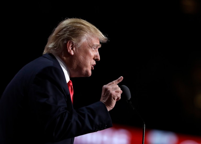 Seeks to portray Kaine as a backer of deal opposed by both Trump and Sanders supporters. (AP Photo/Evan Vucci)