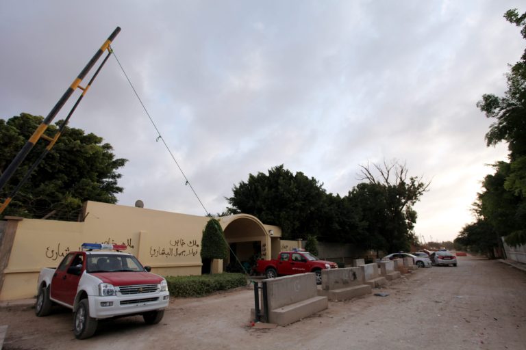 Libyan investigators cars are parked in front of the U.S. Consulate during their investigation regarding the attack that killed four Americans, including Ambassador Chris Stevens on the night of Tuesday, in Benghazi, Libya, Saturday, Sept. 15, 2012.  The American ambassador to Libya and three other Americans were killed when a mob of protesters and gunmen overwhelmed the U.S. Consulate in Benghazi, setting fire to it in outrage over a film that ridicules Islam's Prophet Muhammad. Ambassador Chris Stevens, 52, died as he and a group of embassy employees went to the consulate to try to evacuate staff as a crowd of hundreds attacked the consulate Tuesday evening, many of them firing machine-guns and rocket-propelled grenades.  (AP photo/Mohammad Hannon)