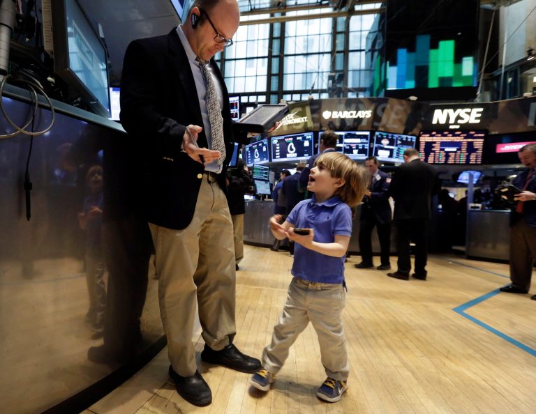 Tripp Mancuso, 4, works with his trader father Peter Mancuso on the floor of the New York Stock Exchange, during the NYSE Working Parents/Caregivers Employee Resource Group's annual Take Your Child to Work Day program, Thursday, April 24, 2014. Mixed earnings from a large number of U.S. companies left the stock market without direction early Thursday, despite positive results from a handful of names including Apple and Caterpillar. (AP Photo/Richard Drew)