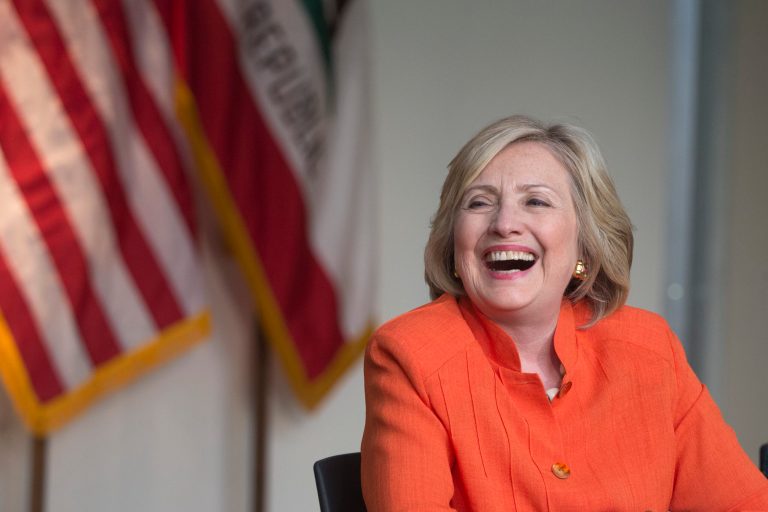 Democratic presidential candidate Hillary Rodham Clinton laughs while listening to a home care worker during a roundtable discussion home care, Thursday, Aug. 6, 2015, in Los Angeles. (AP Photo/Jae C. Hong)