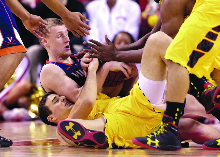 Patrick Semansky/AP
Logan Aronhalt and Maryland went to a 1-3-1 press against Paul Jesperson and Virginia in the second half on Sunday.