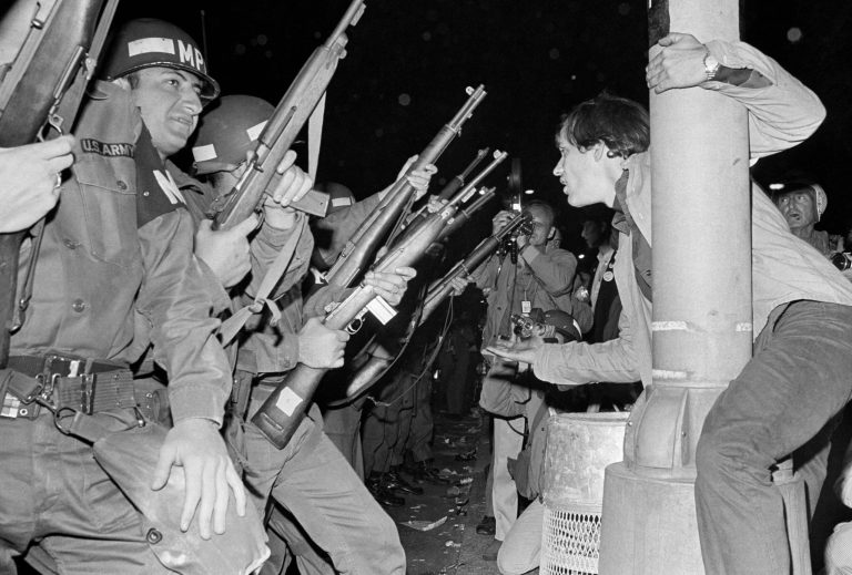 Jeers greet military police as they attempt to disperse demonstrators outside the Conrad Hilton, Democratic Convention headquarters hotel Wednesday, August 29, 1968. (AP Photo/RHS)