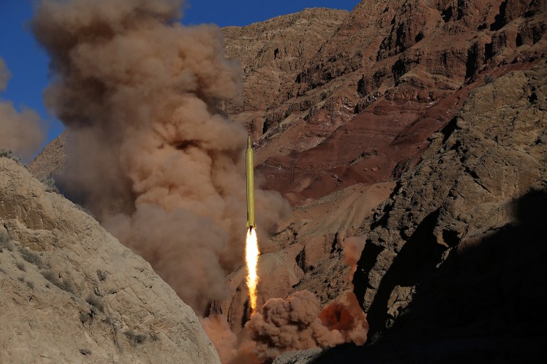 A long-range ballistic surface-to-surface missile is fired by Iran's powerful Revolutionary Guard, during a maneuver, in an undisclosed location in Iran. (AP Photo/Fars News Agency, Omid Vahabzadeh)