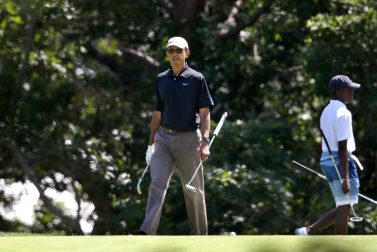 President Obama sits in a golf cart while golfing at Farm Neck Golf Club, in Oak Bluffs, Mass., on the island of Martha's Vineyard, Thursday. (AP Photo/Steven Senne)