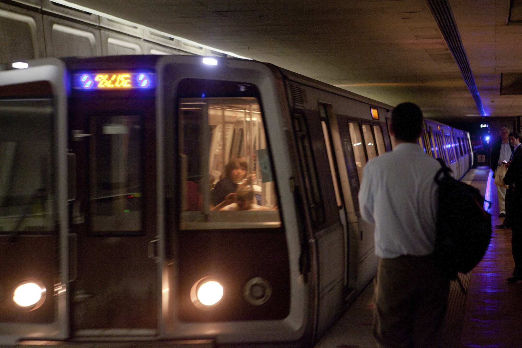 Metro operator stops train before it runs over woman on tracks
