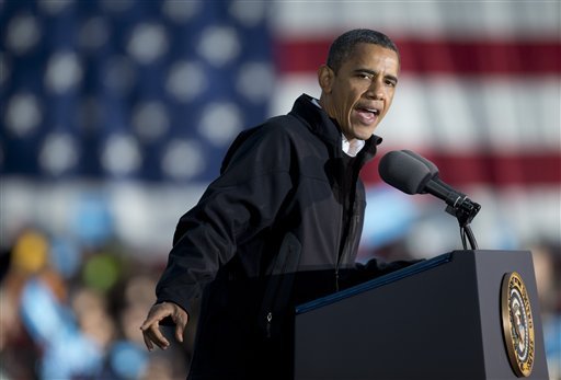 President Barack Obama speaks at a campaign event in Washington Park, Saturday, Nov. 3, 2012, in Dubuque, Iowa, before traveling traveling back to Washington. (AP Photo/Carolyn Kaster)