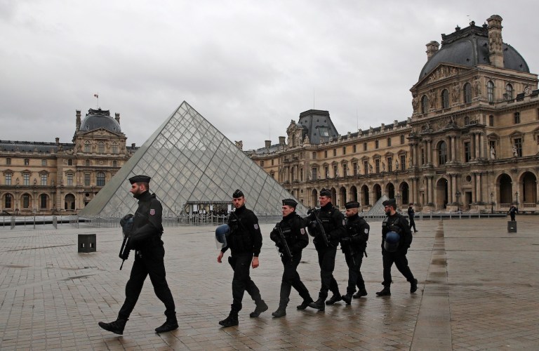 The attack at an entrance to the shopping mall that extends beneath the museum sowed panic and left one soldier wounded. (AP Photo/Christophe Ena)