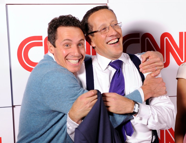 CNN's Chris Cuomo, left, reportedly had a few drinks at a party last month before he got behind the wheel of his classic convertible and crashed it into an SUV during a drag race, according to a recent report. (Photo by Chris Pizzello/Invision/AP)