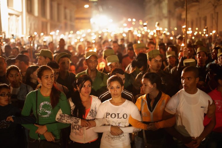 Young Cuban students walk arm-in-arm during the March of the Torches from the University of Havana through the Vedado districts and to the Malecon oceanfront on January 27, 2015, in Havana, Cuba.Â (Getty Image)