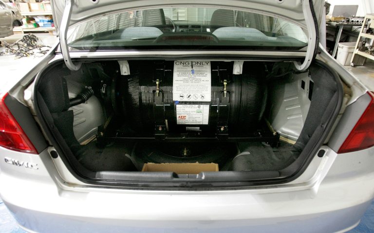 The compressed natural gas tank is seen stored behind the backseat in the trunk of a Honda Civic on Friday, Sept. 23, 2005, in East Liberty, Ohio. (AP Photo/Kiichiro Sato)