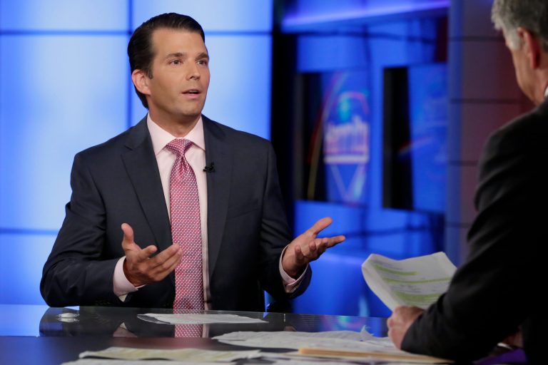 Donald Trump Jr., left, is interviewed by host Sean Hannity on his Fox News Channel television program, in New York Tuesday, July 11, 2017. Donald Trump Jr. eagerly accepted help from what was described to him as a Russian government effort to aid his father's campaign with damaging information about Hillary Clinton, according to emails he released publicly on Tuesday. (AP Photo/Richard Drew)