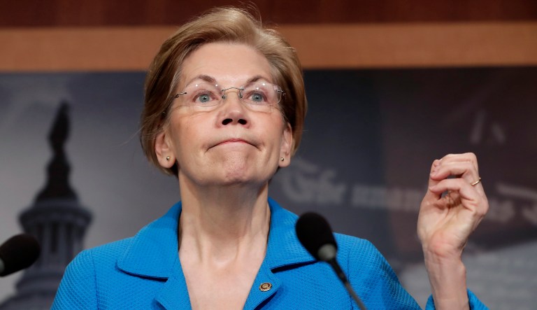Sen. Elizabeth Warren, D-Mass., expresses her opposition to a move in the Senate to pass legislation that would roll back some of the safeguards Congress put into place after a financial crisis rocked the nation's economy ten years ago. (AP Photo/J. Scott Applewhite)