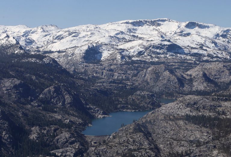 A Sierra Nevada lake surrounded by ridges is seen during an aerial survey of the snowpack done by the California Department of Water Resources, Tuesday, April 28, 2015. (AP Photo)Â 