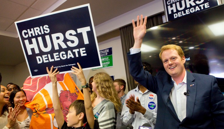 Democrat Chris Hurst defeated Republican Joseph Yost to win House of Delegates District 12 on Tuesday, Nov. 7, 2017, in Blacksburg, Va. Hurst celebrates with a packed room of supporters at The Hyatt Place in Blacksburg. (Heather Rousseau/The Roanoke Times via AP)