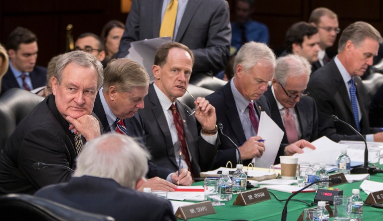 Republican members of the Senate Budget Committee look over amendments during the markup of Senate's fiscal year 2018 budget resolution. (AP Photo/J. Scott Applewhite)