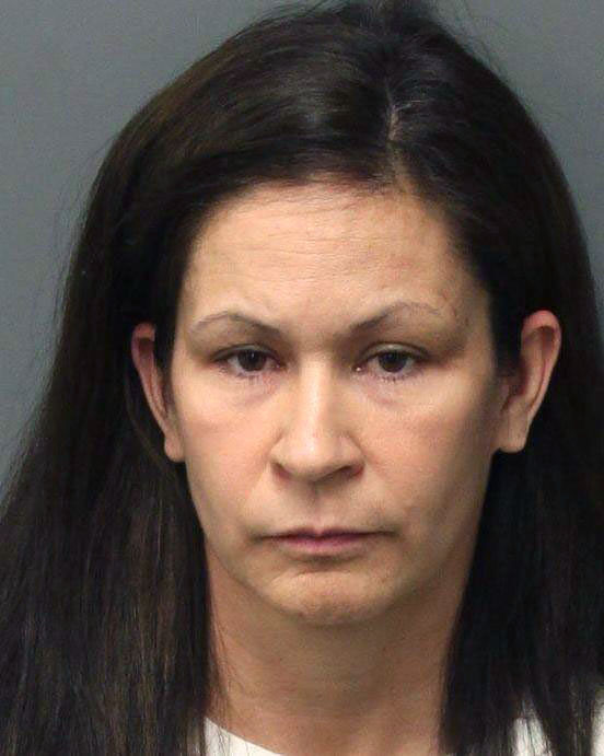 This photo released by the Riverside Police Dept. shows Andrea Michelle Cardosa, 40, who was arrested on Monday, Feb. 3, 2014 in Perris, Calif. Cardosa a former Southern California educator was jailed on felony charges that could send her to prison for life after a former female student accused her of sexual abuse in a YouTube video that's gained nearly a million views and prompted another girl to come forward. (AP Photo/Riverside Police Dept.)