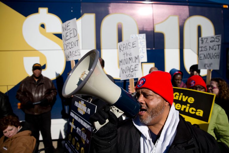 Protestors chant during a news conference in support of raising the minimum wage, in Philadelphia on Thursday. (AP Photo/Matt Rourke)