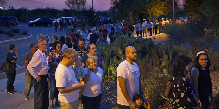 The Democratic Party and Hillary Clinton's campaign are preparing to file a federal lawsuit against Arizona over practices that lead to long lines and wait times in the state's primary. (David Kadlubowski/The Arizona Republic via AP, File)