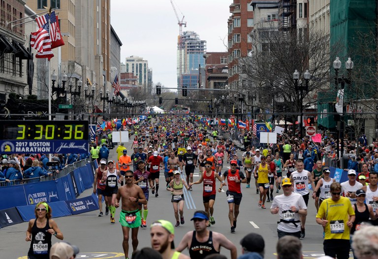 Runners head to the finish line in the 121st Boston Marathon on Monday, April 17, 2017, in Boston. (AP Photo/Elise Amendola)
