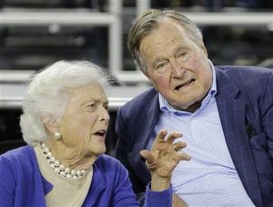George H.W. Bush with wife Barbara, who just turned 90. AP Photo