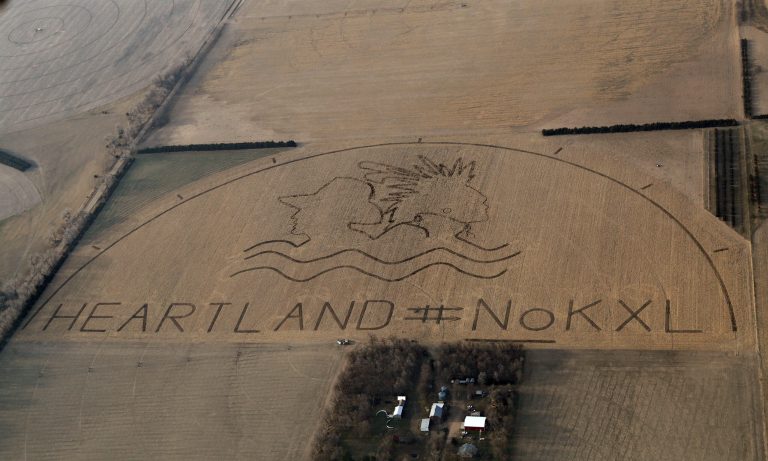In this photo provided by Lou Dematteis,  a huge crop art image protesting the proposed Keystone XL pipeline covers an 80 acre corn field outside of Neligh, Neb.,  on April 12, 2014.    The image was created by the farmers, ranchers and Native American tribes of the Cowboy and Indian Alliance in collaboration with artist John Quigley.  (AP Photo/Courtesy of Lou Dematteis)
