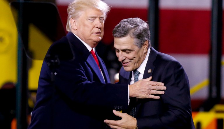 President Donald Trump, left, greets Pa. Rep. Lou Barletta, R.Pa., before a speech at H&K Equipment Co. on Thursday, Jan. 18, in Coraopolis, Pa. Barletta is running for the U.S. Senate. (AP Photo/Keith Srakocic)