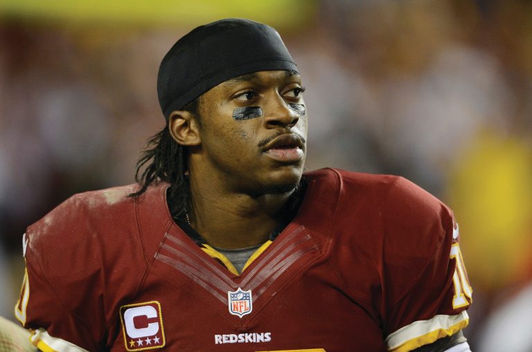 Patrick McDermott/Getty Images
Robert Griffin III's injuries came from his decisions while scrambling, not the zone read option.