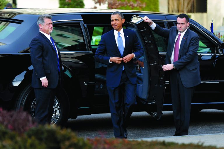 President Barack Obama smiles as he arrives at St. John's Church in Washington, Monday, Jan. 21, 2013, for a church service during the 57th Presidential Inauguration. (AP Photo/Jacquelyn Martin)