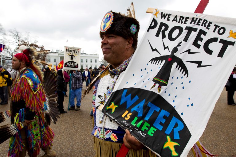 America Indians and their supporters protest outside of the White House, Friday, March 10, 2017, in Washington, to rally against the construction of the disputed Dakota Access oil pipeline. ( AP Photo/Jose Luis Magana)