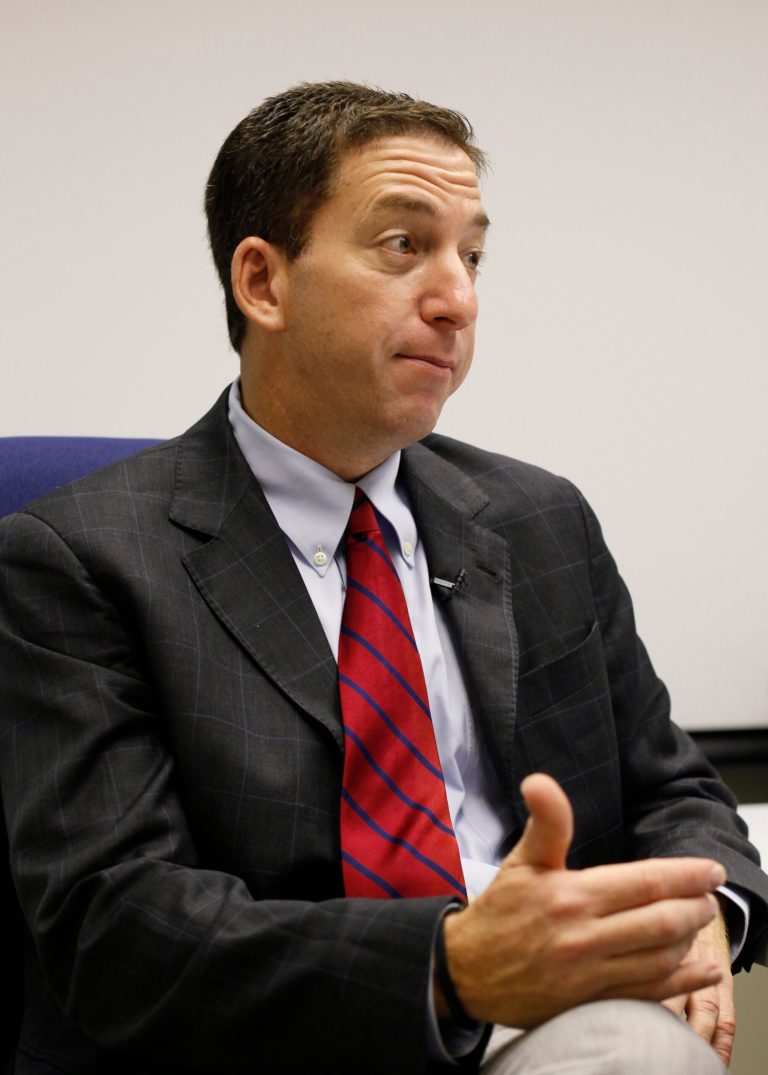 Glenn Greenwald, a reporter of The Guardian newspaper, speaks during an interview in Hong Kong Monday, June 10. (AP Photo/Kin Cheung)