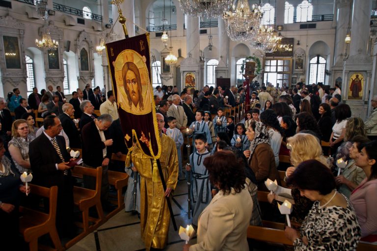   FILE - In this Sunday, April 15, 2012 file photo, Syrian Orthodox Christians attend Easter mass in Damascus, Syria. Christians, who make up about 10 percent of Syria's population of more than 22 million, say they are particularly vulnerable to the violence that has been sweeping the country since March 2011. They are fearful that Syria will become another Iraq, with Christians caught in the crossfire between rival Islamic groups. (AP Photo/Bassem Tellawi, File)  