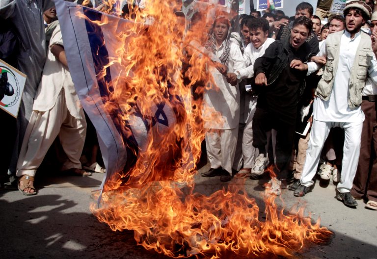 Afghan demonstrators set fire to a representation of the Israeli flag during a rally marking Al-Quds Day in Kabul on Friday. (AP/Rahmat Gul)