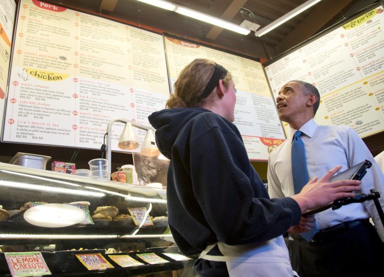 President Obama looks up at the menu at Zingerman's Deli on Wednesday in Ann Arbor, Mich. (AP Photo/Carolyn Kaster)