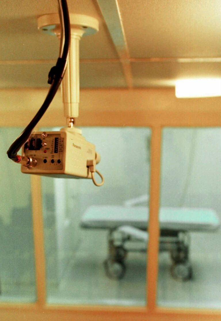 FILE - In this July 30, 1997 file photo, a television camera mounted on the ceiling of a witness room is pointed toward the Arkansas death chamber at Cummins Prison in Varner, Ark. After surrendering its supply of a lethal injection drug to federal agents in 2011, Arkansas turned to a somewhat surprising place to look for another drug: a list prepared by lawyers for several death row inmates. The state Department of Correction has told The Associated Press that it decided to use phenobarbital after attorneys for several death row inmates mentioned in a lawsuit that it might be an available drug that's regulated by the Food and Drug Administration. (AP Photo/Danny Johnston, File)