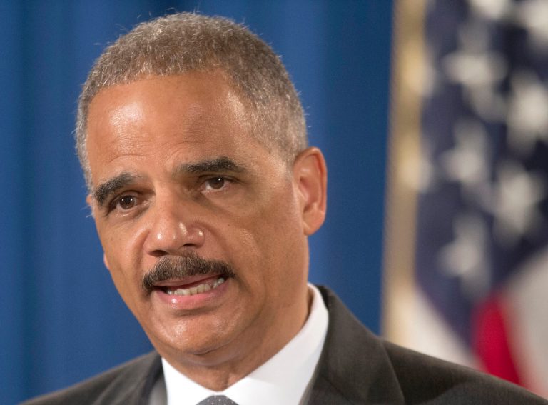 FILE - This July 14, 2014 file photo shows Attorney General Eric Holder speaking at the Justice Department in Washington. Holder cautioned against the use of data in sentencing criminal defendants, saying judges should base punishment on the facts of a crime rather than on statistical predictions of future behavior that can be unfair to minorities. (AP Photo/Pablo Martinez Monsivais, File)